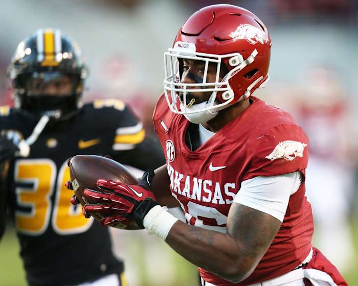 Nov 26, 2021; Fayetteville, Arkansas, USA; Arkansas Razorbacks wide receiver Treylon Burks (16) catches a pass and runs it in for a touchdown in the third quarter against the Missouri Tigers at Donald W. Reynolds Razorbacks Stadium. Mandatory Credit: Nelson Chenault-USA TODAY Sports